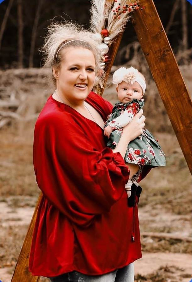 Sabra Allison, who is a new teacher at CHHS, holds her daughter.