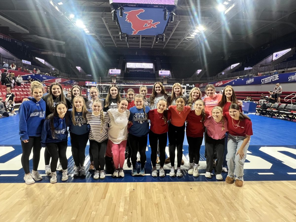 Blue Devil volleyball gathers as a team at the SMU and Kentucky game.