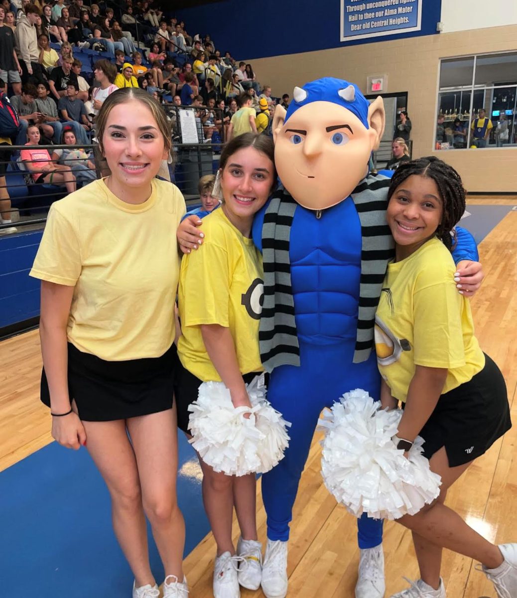 Cheerleaders pose with Blue Devil mascot Diablo. From left: Aliyah DeLevega, Monica  Cantu, Diablo, Azelyn Simms