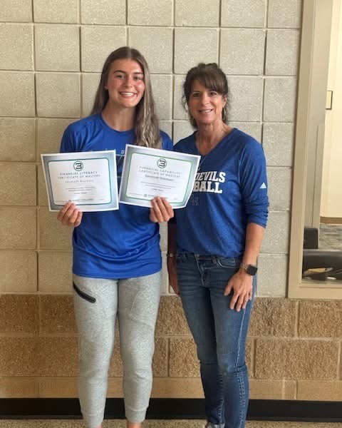  Senior Savannah Breckeen is pictured along with financial math teacher Donna Tipton earning the "top student" distinction in the “Budget Challenge” competition.
